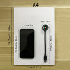 Lampe USB noire et téléphone posés sur une feuille A4, avec repères de dimensions.