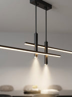 Suspension Linéva Noir Charbon allumée, avec vue sur les câbles et la fixation au plafond.