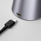 Axis — port usb-c du socle gris, câble illustré