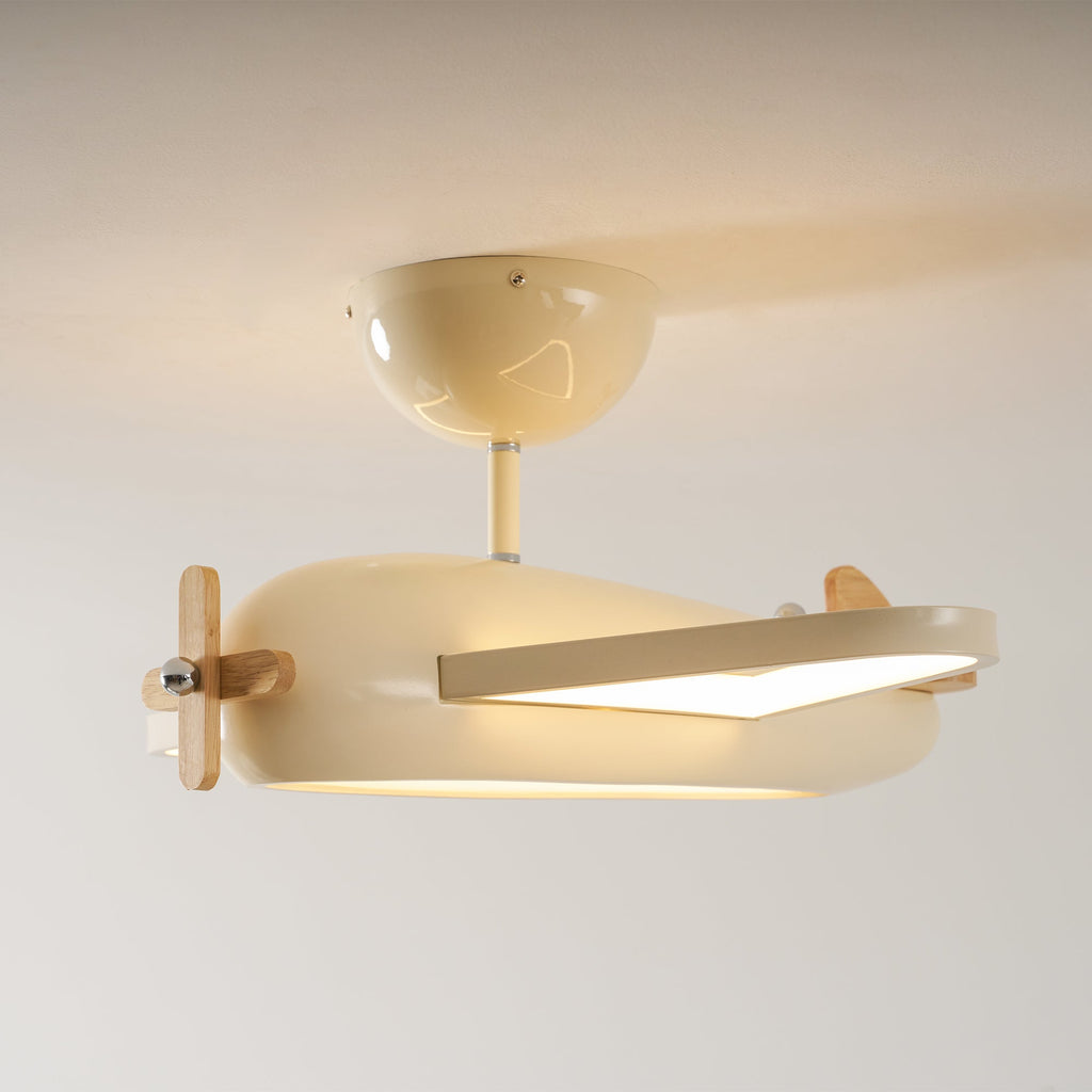Vue de profil du plafonnier avion beige allumé, avec rosace et courte tige de fixation.