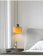 Suspension cylindrique — Orange / Vert olive.