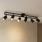 Spot pour plafond Lindby Bravius, noir, à 6 lampes, fer — vue allumée de face — photo fabricant