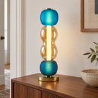Arlequin — modèle B en verre bleu et ambre sur une console
