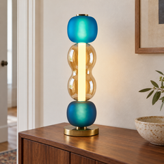 Arlequin — modèle B en verre bleu et ambre sur une console