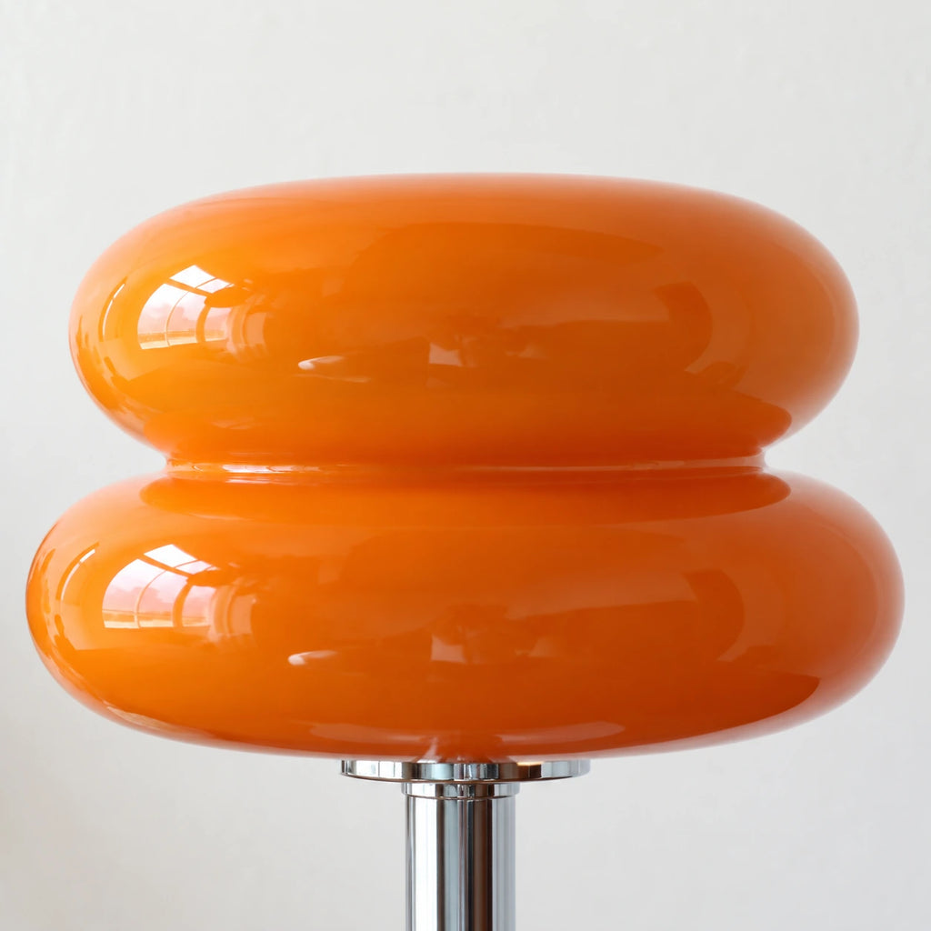 Orélia Orange — détail des deux lobes en verre brillant, mise en scène illustrative.