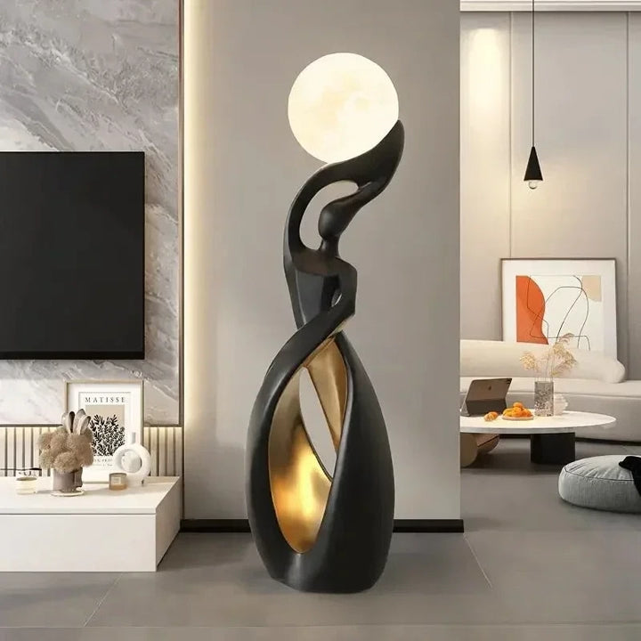 Lampe sculpturale noir et doré — présentation photographique, trois vues du modèle